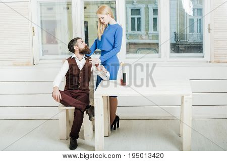 Woman Standing At Man Drinking Red Wine