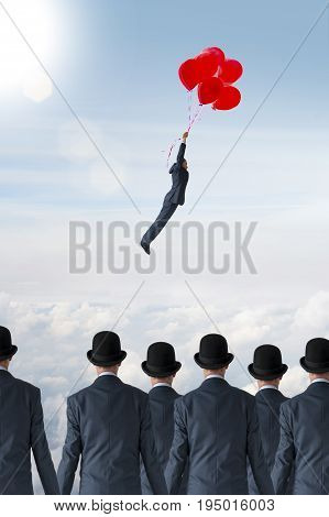 business individuality concept businessman flying away from crowd with balloons