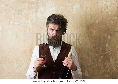 Man Holding Bottle And Glass Of Wine