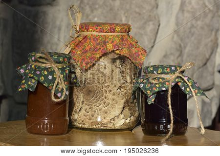Jars Of Jam And Dried Mushrooms - Macrolepiota Procera , On Wooden Board