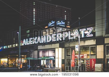 Illuminated Letters Of The Alexanderplatz Train Station Exterior At Night In Berlin