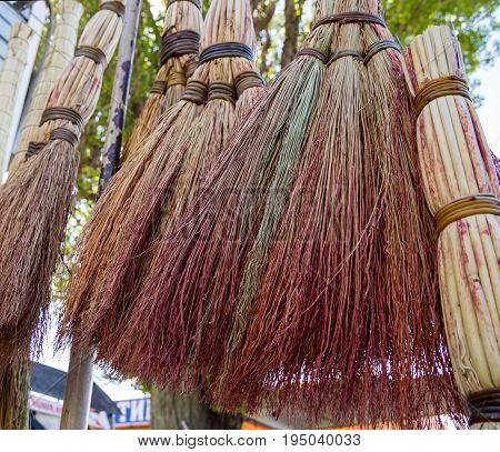 Traditional Russian brooms hang over the market counter
