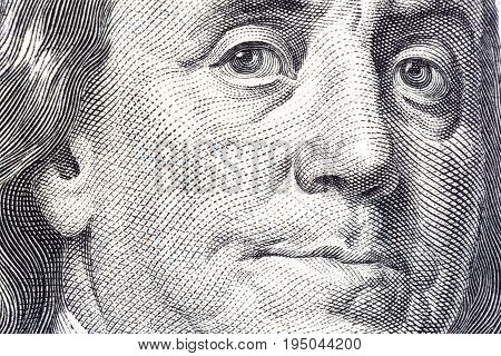 Portrait of Benjamin Franklin on one hundred dollar bill close-up.