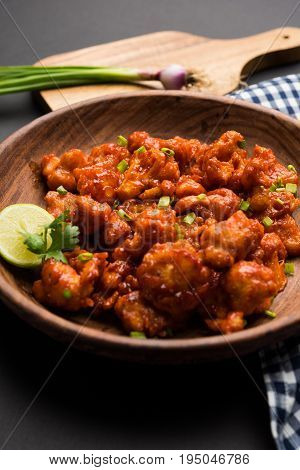 Gobi Manchurian dry - Popular street food of India made of cauliflower florets, selective focus