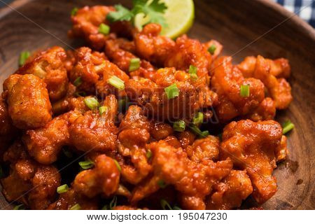 Gobi Manchurian dry - Popular street food of India made of cauliflower florets, selective focus