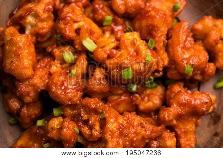 Gobi Manchurian dry - Popular street food of India made of cauliflower florets, selective focus