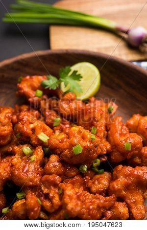 Gobi Manchurian dry - Popular street food of India made of cauliflower florets, selective focus