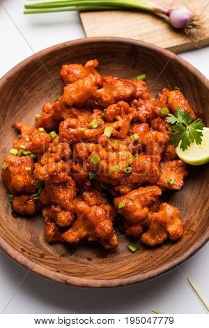 Gobi Manchurian dry - Popular street food of India made of cauliflower florets, selective focus