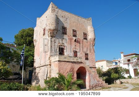 AEGINA, GREECE - APRIL 26, 2017: The historic Markellos Tower in Aegina Town on the Greek island of Aegina. The tower was once used as a seat of Greek government during the War of Independence.