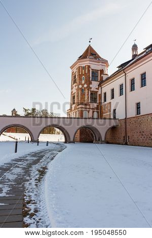 Mir Castle in Minsk region is ancient heritage of Belarus. UNESCO World Heritage. Winter scene with snow.