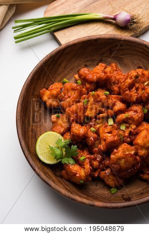 Gobi Manchurian dry - Popular street food of India made of cauliflower florets, selective focus