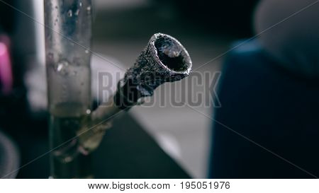 .smoking Marijuana With A Bong Close-up . Legalization And Dependence On Light Drugs
