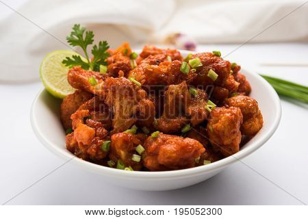 Gobi Manchurian dry - Popular street food of India made of cauliflower florets, selective focus