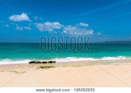 BORACAY WESTERN VISAYAS PHILIPPINES - JANUARY 14 2015: The Puka Beach is a real paradise for tourists to relax looking the sea. Nobody in the picture is this sunny day.