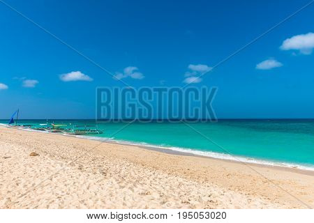 BORACAY WESTERN VISAYAS PHILIPPINES - JANUARY 14 2015: Some traditionals boats for island hopping bringing tourists to Puka Beach.