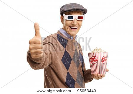 Senior with 3D glasses and popcorn making a thumb up sign isolated on white background