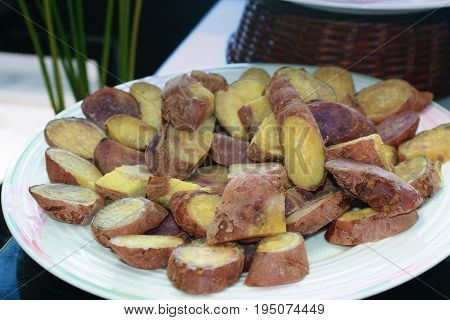 yam or sweet potato, boiled, sliced and served in a round plate
Yam or sweet potato is also called kamote in the Philippines