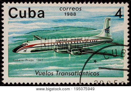 Moscow Russia - January 17 2017: A stamp printed in Cuba shows passenger airliner Douglas DC-7 Airline Havana-Prague (1961) series 