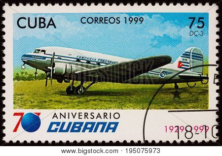 Moscow Russia - July 11 2017: A stamp printed in Cuba shows passenger aircraft Douglas DC-3 series 