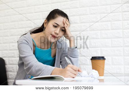 Asian woman working with serious situation at office woman with stressful concept 20-30 years old.