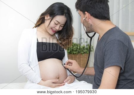 Man Using Stethoscope Check Stomach Her Mother.