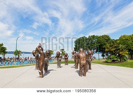 VANCOUVER CANADA - JUNE 25: A-maze-ing Laughter bronze sculpture in Morton Park on June 25 2017 in Vancouver Canada. The installation was created as part of an open-air museum for Contemporary Art in Canada.