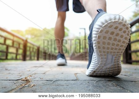 running man. Male runner at sprinting speed training for marathon outdoors.