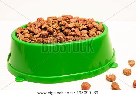 delicious dry food for pets in plastic bowl