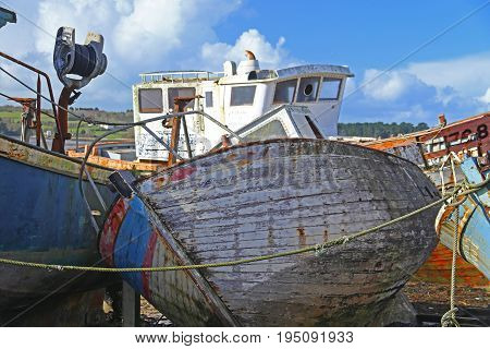 Wrecks of fishing boats at the Rostellec ships cemetery Crozon peninsula Finistere Brittany France