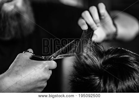 Hair styling man in hairsalon by hairdresser