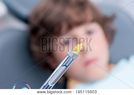 Selective Focus Of Dentist Holding Dental Syringe For Injection