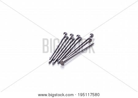 Photo of long screws on awhite empty background
