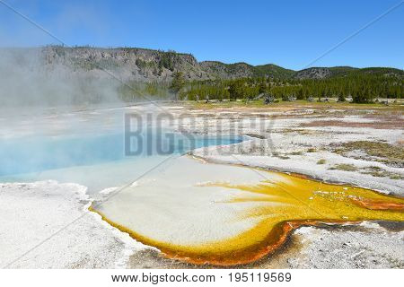 Sapphire Pool, named for its blue, crystal-clear water and for its resemblance to an Oriental sapphire. In the Biscuit Basin area of Yellowstone National Park.