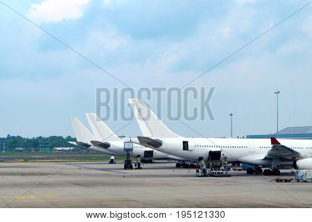 Aircraft parked at the airport. Tails of aircraft