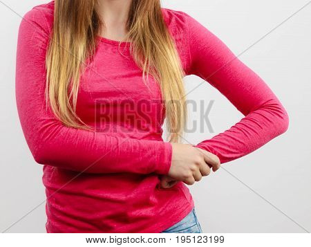 Part of body female chest and hips girl wearing pink blouse long brown hair