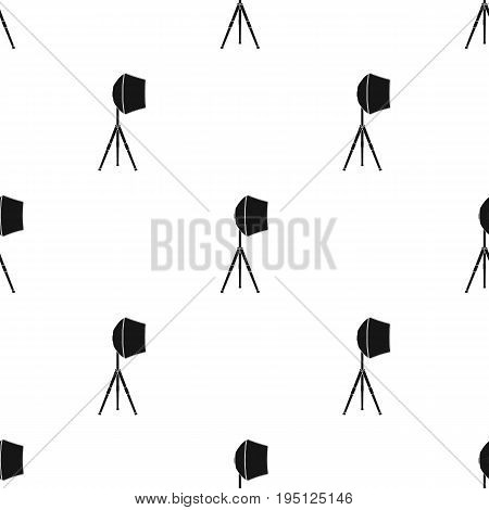 Lighting device on a tripod.Making movie single icon in black style vector symbol stock illustration .