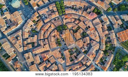 Aerial top view of Bram medieval village architecture and roofs from above, Southern France