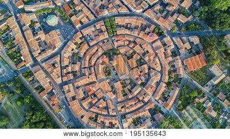 Aerial top view of Bram medieval village architecture and roofs from above, Southern France