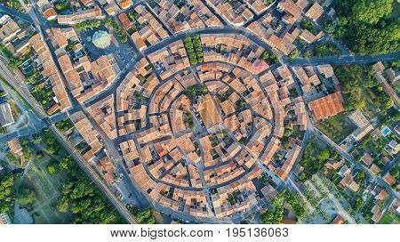 Aerial top view of Bram medieval village architecture and roofs from above, Southern France