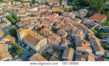 Aerial top view of Bram medieval village architecture and roofs from above, Southern France