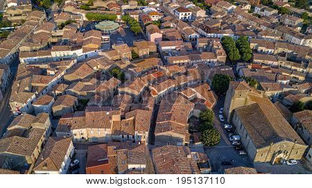 Aerial top view of Bram medieval village architecture and roofs from above, Southern France
