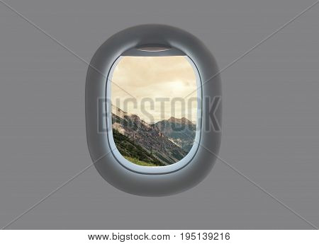 Landscape of Mountains lake and clouds of South Tyrol In Italy in the plane window