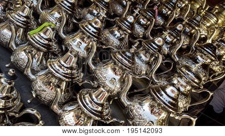 Group of Moroccan teapots in the window of a local flea market