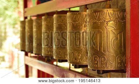 Tibetan praying wheels at Norbulingka Institute Dharamshala India