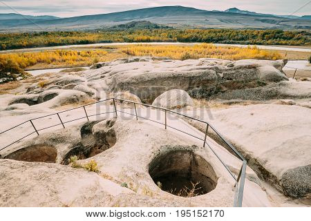 Uplistsikhe, Shida Kartli Region, Georgia. Remnants Of Altar In Famous Landmark Uplistsikhe Is An Ancient Rock-hewn Town In Eastern Georgia. Landscape In Sunny Autumn Day. UNESCO  World Heritage Site.