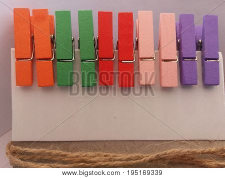 Clothes pegs 3. Five pairs of wooden clothes pegs placed horizontally