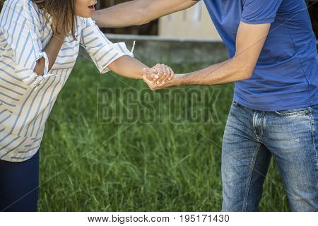 guy making the heimlich maneuver to a girl while she's choking