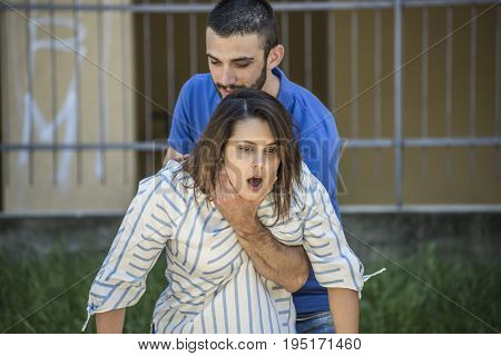 guy making the heimlich maneuver to a girl while she's choking