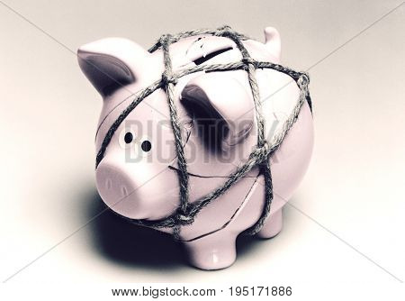 Broken Piggy Bank Reassembled with Twine