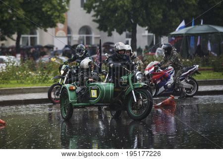 Russia, the city of Novokuibyshevsk, June 24, 2017, Technopark-2017 festival, rain and cars.